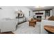 Open concept living room boasts fireplace with seating area and wood accents at 290 Dania Dr, Alpharetta, GA 30009