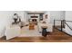 Comfortable living room with a fireplace, hardwood floors, and stylish modern furniture at 290 Dania Dr, Alpharetta, GA 30009