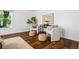 Cozy sitting area with two chairs, accent table, and hardwood floors at 290 Dania Dr, Alpharetta, GA 30009