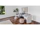 Relaxing sitting area with modern chairs, decorative pillows, and stylish side table at 290 Dania Dr, Alpharetta, GA 30009