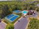 Aerial view of community amenities, including tennis courts, pool, and well-maintained landscaping at 6477 Blue Water Dr, Buford, GA 30518