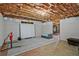 Unfinished basement with seating area and plenty of room for customization at 6477 Blue Water Dr, Buford, GA 30518