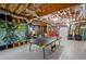 Partially finished basement with ping pong table and room for recreational activities at 6477 Blue Water Dr, Buford, GA 30518