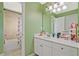 Bright bathroom featuring a shower/tub combination, large vanity, and a mirror at 6477 Blue Water Dr, Buford, GA 30518
