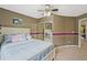 Bedroom featuring a mirrored closet, and blue bedding at 6477 Blue Water Dr, Buford, GA 30518