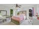 Bright bedroom with a ceiling fan, plenty of sunlight, and modern furnishings at 6477 Blue Water Dr, Buford, GA 30518