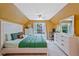 Bright bedroom features large windows, white furniture, and a comfortable bed at 6477 Blue Water Dr, Buford, GA 30518