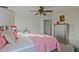 Bright bedroom with a ceiling fan, silver dresser, and a comfortable bed at 6477 Blue Water Dr, Buford, GA 30518