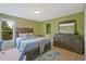 Cozy bedroom with a soft color scheme and comfortable furnishings at 6477 Blue Water Dr, Buford, GA 30518