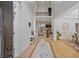 Grand foyer with soaring ceilings, hardwood floors, and elegant details leading to open living spaces at 6477 Blue Water Dr, Buford, GA 30518