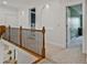 Bright hallway featuring architectural alcoves and neutral carpet at 6477 Blue Water Dr, Buford, GA 30518