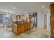 Lovely kitchen featuring a center island with dark granite countertops and hardwood floors at 6477 Blue Water Dr, Buford, GA 30518