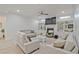 Inviting living room with a fireplace, built-in shelving, and neutral decor for a relaxing ambiance at 6477 Blue Water Dr, Buford, GA 30518