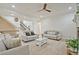 Cozy living room boasting neutral tones, plush seating, and a staircase, perfect for relaxation at 6477 Blue Water Dr, Buford, GA 30518