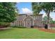 Spacious backyard with a well-kept lawn, patio, and outdoor dining area at 910 Ovalene Sw Ln, Marietta, GA 30064