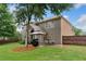 View of backyard with a well-kept lawn, patio, and outdoor dining area at 910 Ovalene Sw Ln, Marietta, GA 30064