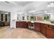 Bright bathroom with dual sink vanities, tiled floors, and garden views at 910 Ovalene Sw Ln, Marietta, GA 30064