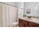 Bathroom featuring a vanity, framed mirror, neutral paint and shower with curtain at 910 Ovalene Sw Ln, Marietta, GA 30064