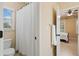 Bathroom featuring toilet, shower with curtain, and view of the bedroom at 910 Ovalene Sw Ln, Marietta, GA 30064