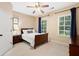 Inviting bedroom with natural light, neutral carpet, ceiling fan, and windows with blinds at 910 Ovalene Sw Ln, Marietta, GA 30064