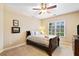 Bedroom with a cozy bed, neutral-toned walls, and a bright window view at 910 Ovalene Sw Ln, Marietta, GA 30064