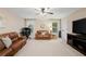 Large bonus room featuring two sofas, media center, and computer desk at 910 Ovalene Sw Ln, Marietta, GA 30064