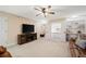 Spacious bonus room featuring built-in shelving, media center, and lots of natural light at 910 Ovalene Sw Ln, Marietta, GA 30064