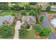 Aerial view of a two-story brick home with a driveway and landscaped front yard at 910 Ovalene Sw Ln, Marietta, GA 30064
