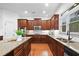 Modern kitchen with granite countertops, stainless steel appliances, and a stylish island at 910 Ovalene Sw Ln, Marietta, GA 30064