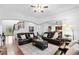Elegant living room featuring hardwood floors, stylish furnishings and ample space for entertaining at 910 Ovalene Sw Ln, Marietta, GA 30064