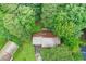 Aerial view of the home surrounded by lush trees, showcasing its serene setting at 1757 Mystery Sw Cir, Conyers, GA 30094