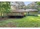 The backyard features a wooden deck and a grassy lawn, perfect for outdoor enjoyment at 1757 Mystery Sw Cir, Conyers, GA 30094