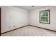 Cozy bedroom with neutral carpet and trim with a window providing natural light at 1757 Mystery Sw Cir, Conyers, GA 30094