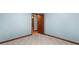 Bedroom features grey walls, wood trim, and carpet at 1757 Mystery Sw Cir, Conyers, GA 30094