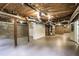 Spacious basement with exposed utilities, and a door providing outdoor access at 3323 Lancing Ct, Duluth, GA 30096