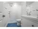 Stylish bathroom featuring blue tile floors, a sleek vanity, and a walk-in shower with glass doors at 3323 Lancing Ct, Duluth, GA 30096