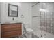 Modern bathroom featuring patterned tile, vanity, vessel sink, and glass shower at 3323 Lancing Ct, Duluth, GA 30096