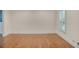 Sunlit bedroom with beautiful hardwood floors and crisp white trim at 3323 Lancing Ct, Duluth, GA 30096