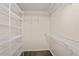 Spacious walk-in closet with white wire shelving and hardwood floors at 3323 Lancing Ct, Duluth, GA 30096