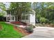 Beautiful two-story home boasts a painted brick exterior, an American flag and lovely landscaping at 3323 Lancing Ct, Duluth, GA 30096