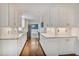Bright kitchen with white cabinets, granite countertops, and stainless steel appliances at 3323 Lancing Ct, Duluth, GA 30096