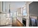 Kitchen boasts granite countertops, stainless appliances, and ample cabinet space at 3323 Lancing Ct, Duluth, GA 30096