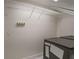 Laundry room with white wire shelving and a black washing machine at 3323 Lancing Ct, Duluth, GA 30096