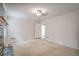 Spacious living room featuring neutral carpet and classic fireplace detail at 3323 Lancing Ct, Duluth, GA 30096