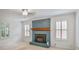Cozy living room with a blue brick fireplace and shuttered windows at 3323 Lancing Ct, Duluth, GA 30096