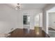 Open-concept living room showcasing beautiful hardwood floors and a seamless transition to other rooms at 3323 Lancing Ct, Duluth, GA 30096