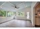 Bright sunroom with large windows, ceiling fan, and access to the outdoors at 3323 Lancing Ct, Duluth, GA 30096