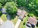 Overhead aerial view of a landscaped home with a long driveway and lush green lawn at 5600 Walnut Creek Nw Ct, Lilburn, GA 30047