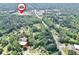 Expansive aerial view showcasing a lush green neighborhood and the home's location at 5600 Walnut Creek Nw Ct, Lilburn, GA 30047