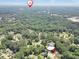 Extensive aerial view capturing the verdant surroundings and neighborhood featuring the residence at 5600 Walnut Creek Nw Ct, Lilburn, GA 30047